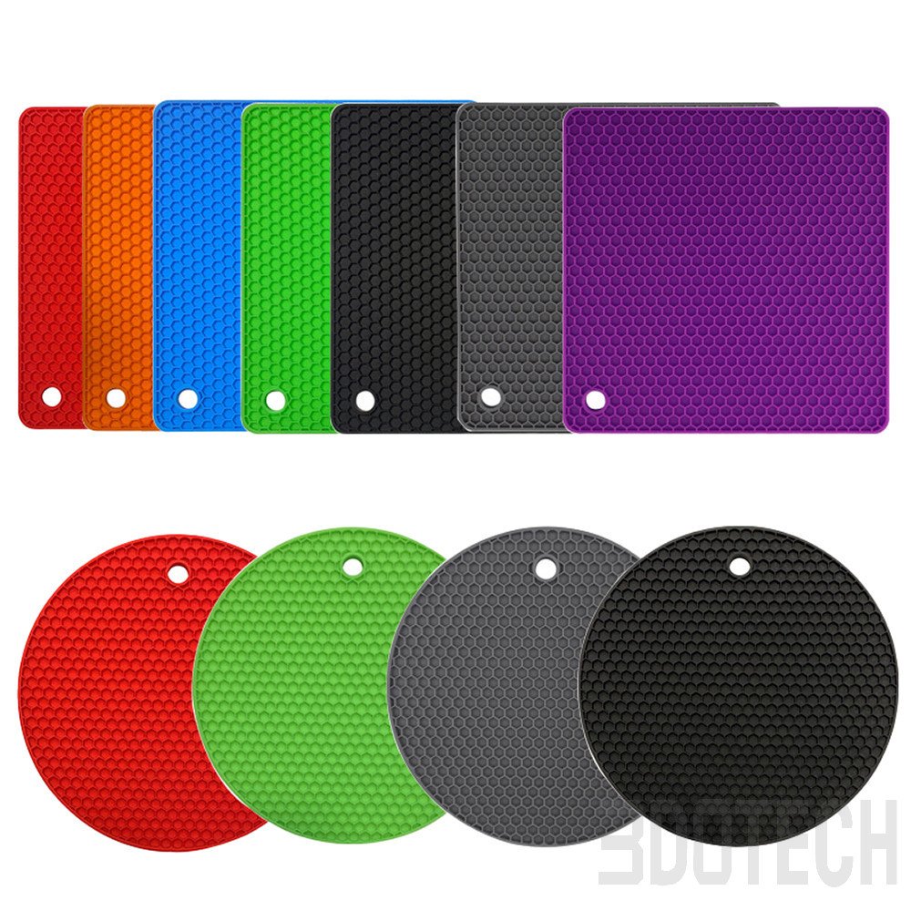 Stacked vibrant heat-resistant silicone trivet mats showing flexible honeycomb grid non-slip texture